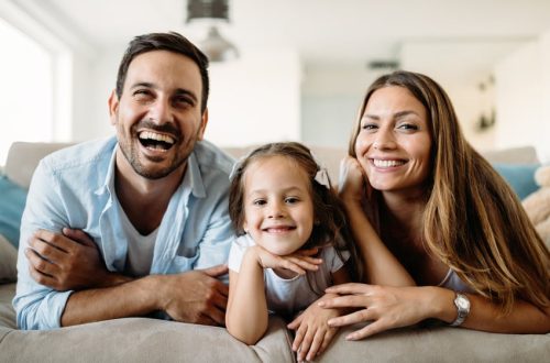 Happy family having fun time watchin tv at home